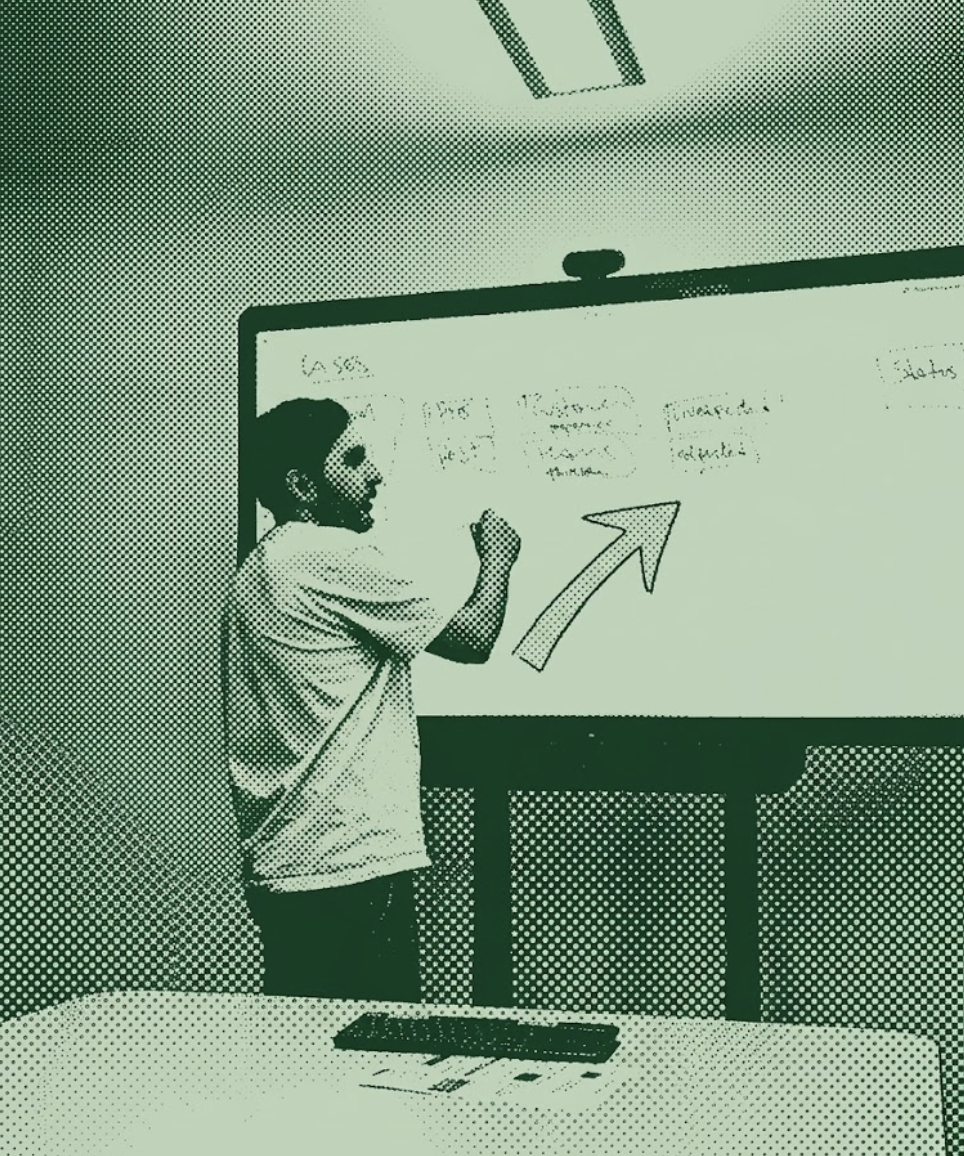 Nicolas facilitating a design thinking workshop at a whiteboard